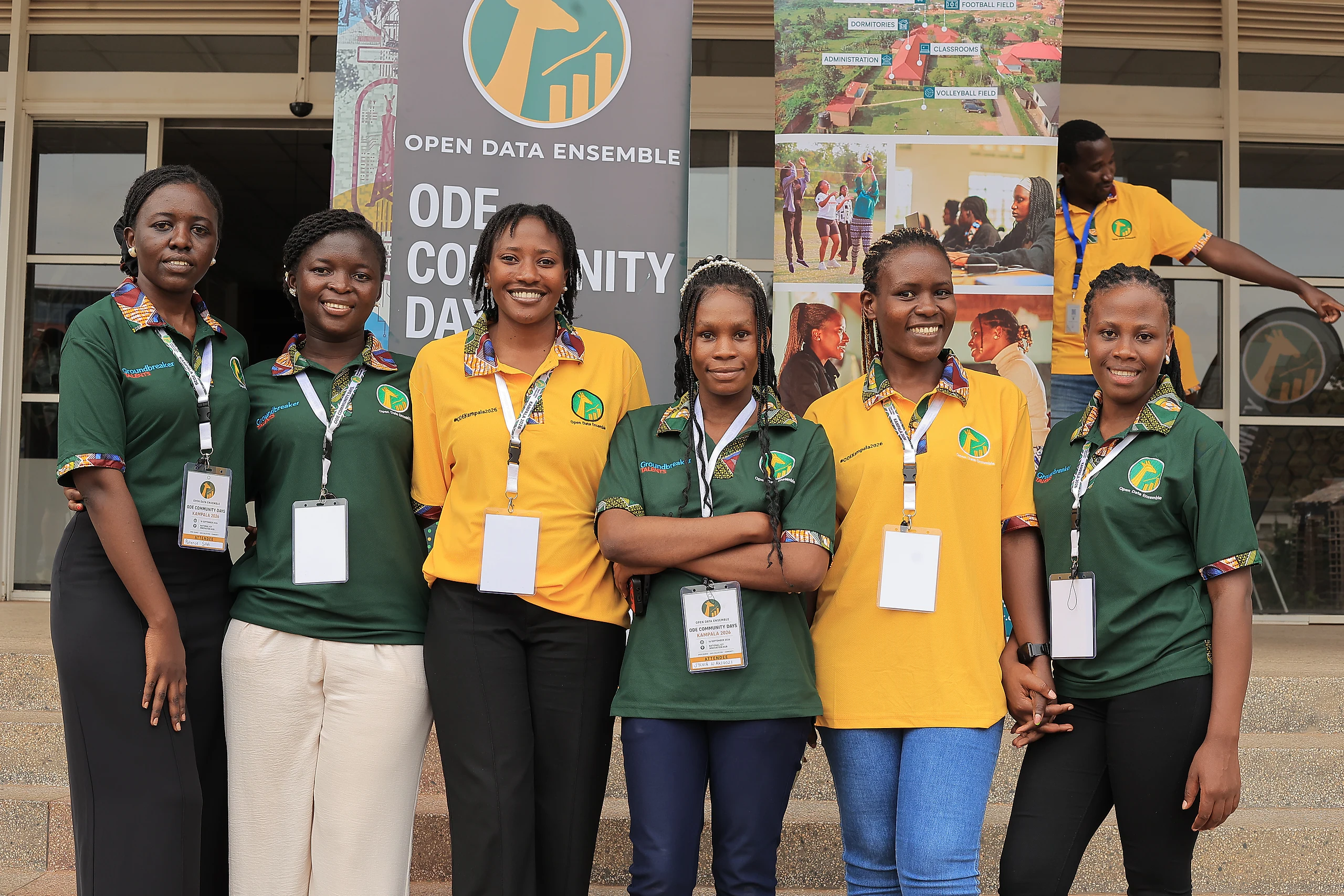 Participants line up for a photo in front of the ODE banner.