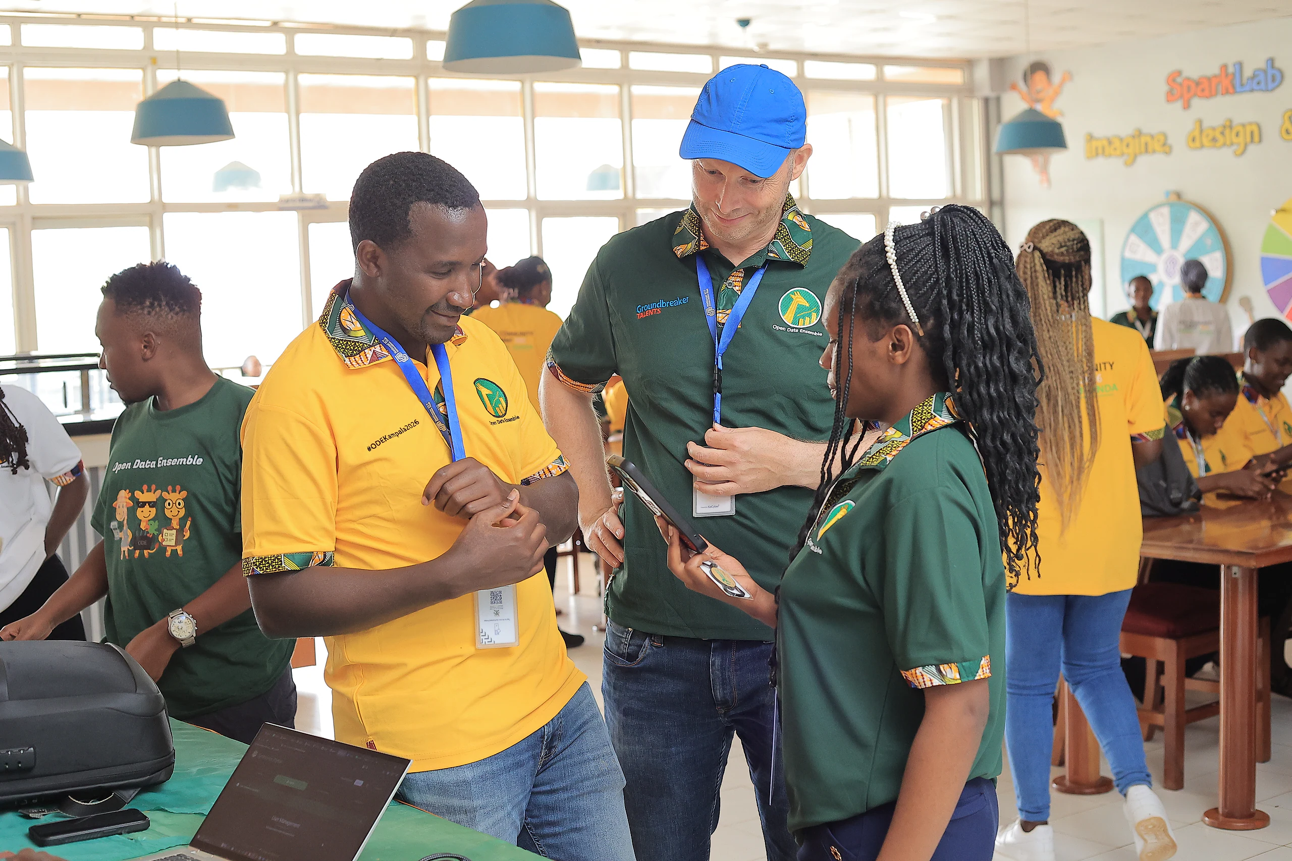 A group gathers around a facilitator to try an exercise.