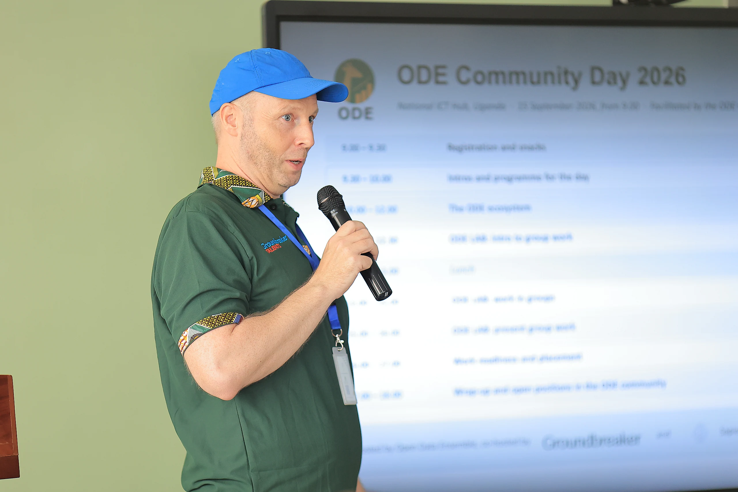A facilitator walks the room through the programme for the day.
